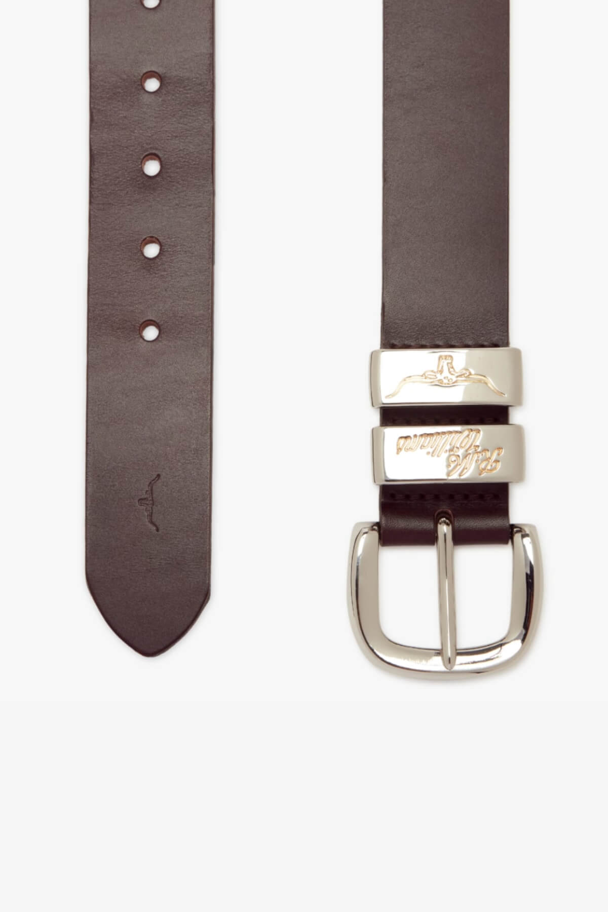 A RM Williams 1 1/2 Jerrawa Belt in dark brown with a pointed end and multiple holes for adjustment is shown. The belt features an elegant polished nickel buckle and a metallic keeper engraved with logos. Made from solid hide leather, the belt is displayed flat with the buckle on the right.