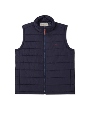 The RM Williams Patterson Creek Vest is a navy blue, sleeveless quilted vest crafted from recycled materials with a high collar and front zipper. It showcases horizontal stitching and has a small logo on the upper left chest area.