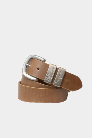 The RM Williams Drover Belt is a tan solid hide leather belt with a brushed nickel rectangular buckle and two silver loops, one engraved with text, shown coiled on a plain light background.