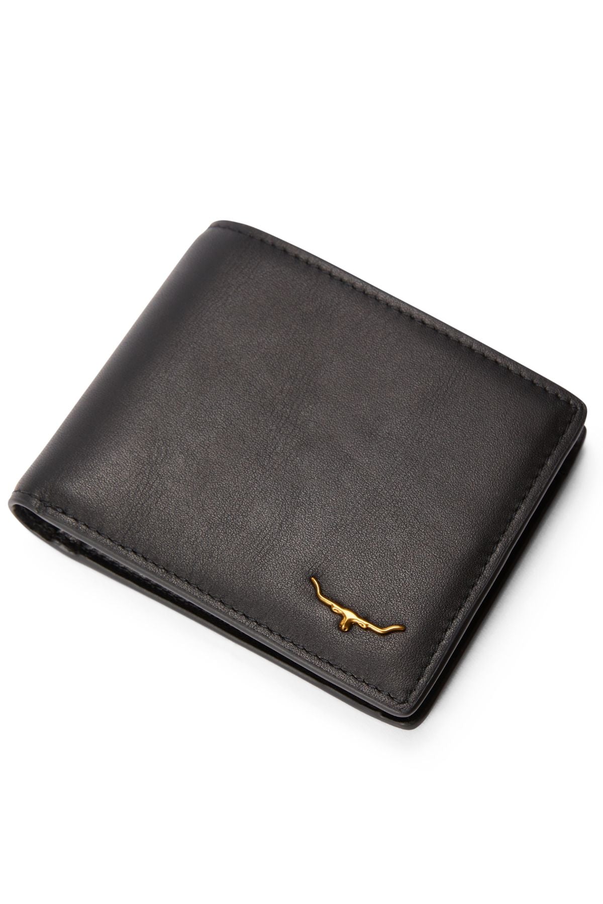The RM Williams Bi Fold Wallet with Pocket, made from black full-grain leather, features a small gold longhorn emblem in the bottom right corner and is photographed on a white background.