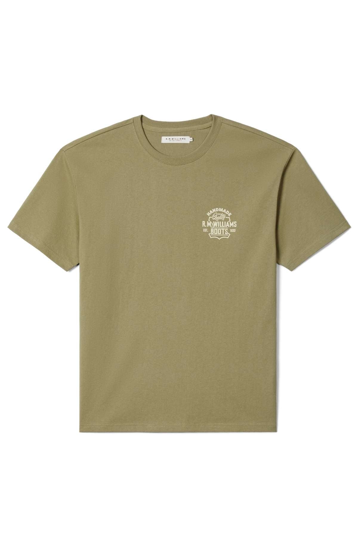 The RM Williams Boot T-Shirt is a plain olive green, short-sleeved tee with a small white "R.M. Williams Boots" logo on the left chest, shown laid flat on a white background.