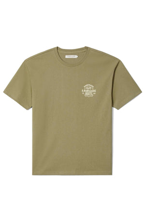 The RM Williams Boot T-Shirt is a plain olive green, short-sleeved tee with a small white "R.M. Williams Boots" logo on the left chest, shown laid flat on a white background.