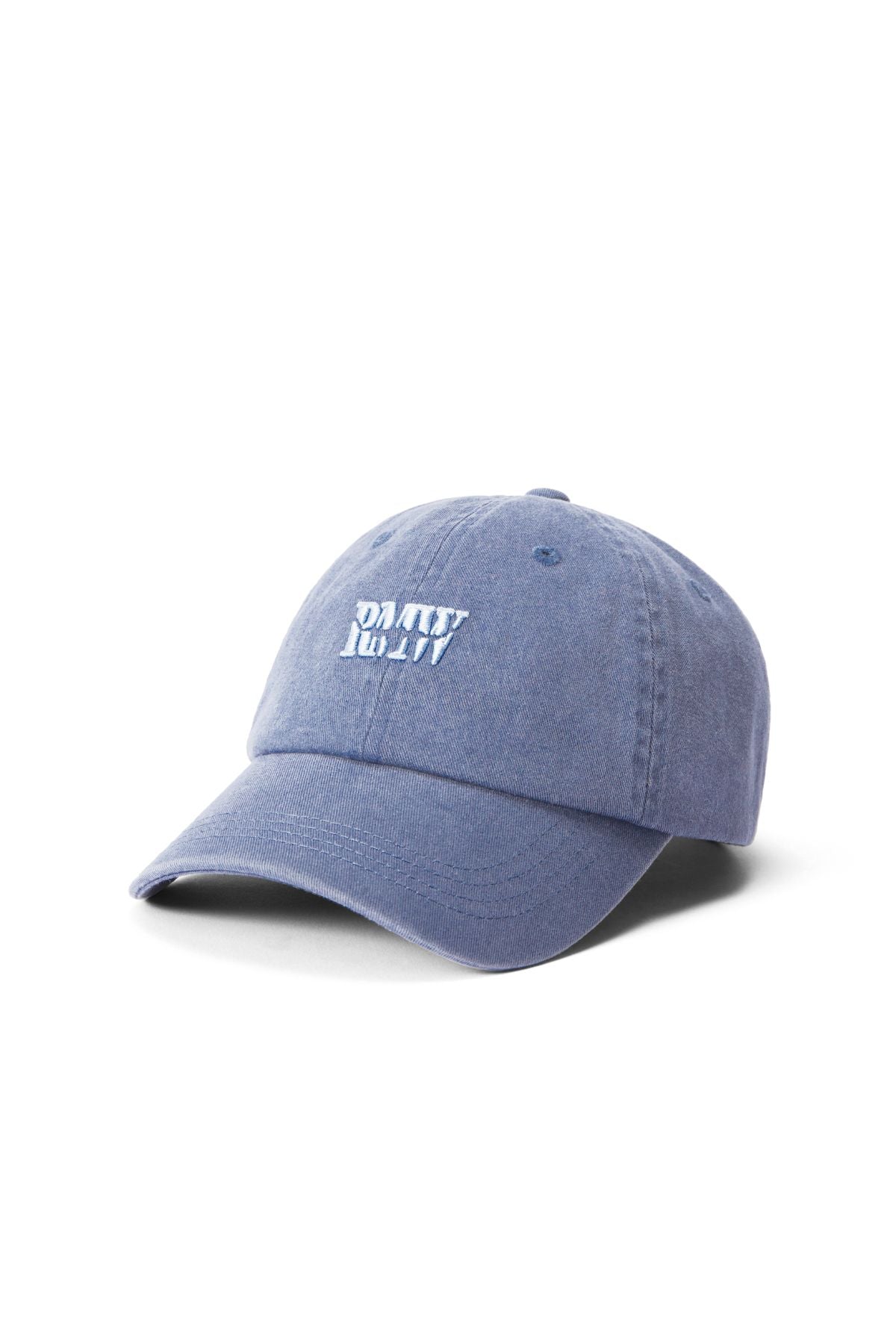 The RM Williams Branded Twill Cap is blue, made from organic cotton, and features a white embroidered heritage logo on the front. It has a curved brim, relaxed fit, adjustable strap, and is shown on a white background.