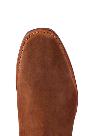 Close-up of the toe area of an RM Williams Comfort Suede Craftsman Boot, showing brown suede leather, visible edge stitching, and a slightly squared shape.