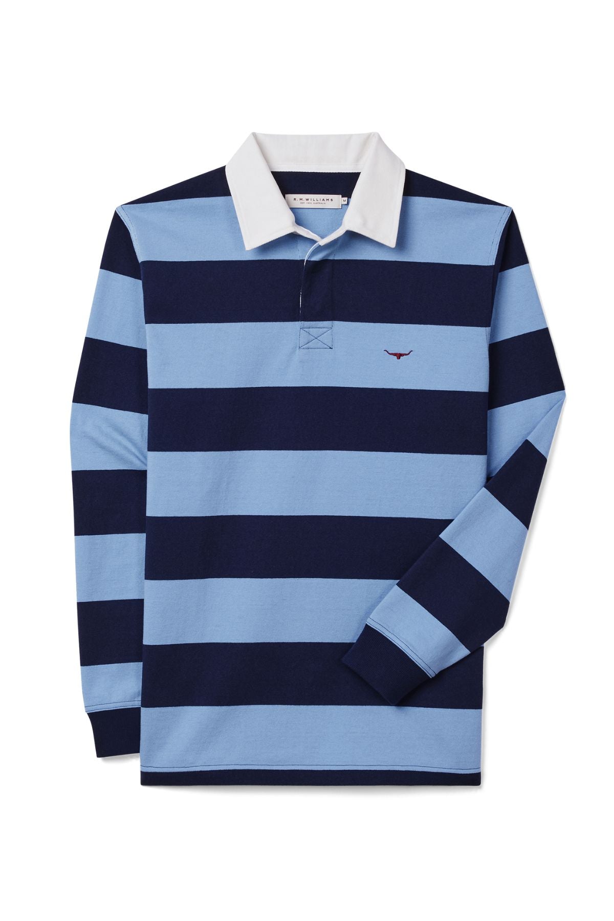 The RM Williams Cradle Rugby is a striped rugby shirt made from organic heavyweight fabric, featuring wide navy and light blue stripes, a white collar, and a small red embroidered logo on the left chest.