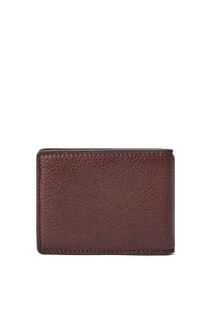 The RM Williams Farrier Bi Fold Clip Wallet is a closed, rectangular brown leather wallet with a slightly textured surface, displayed against a white background.