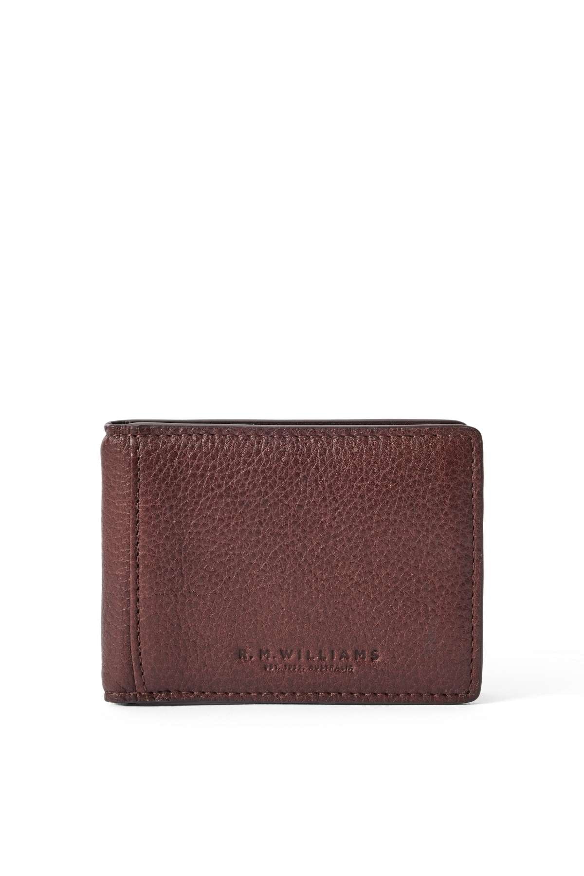 The RM Williams Farrier Bi Fold Clip Wallet is a brown leather wallet with a textured surface, visible stitching, and "R.M. Williams" embossed near the bottom edge.