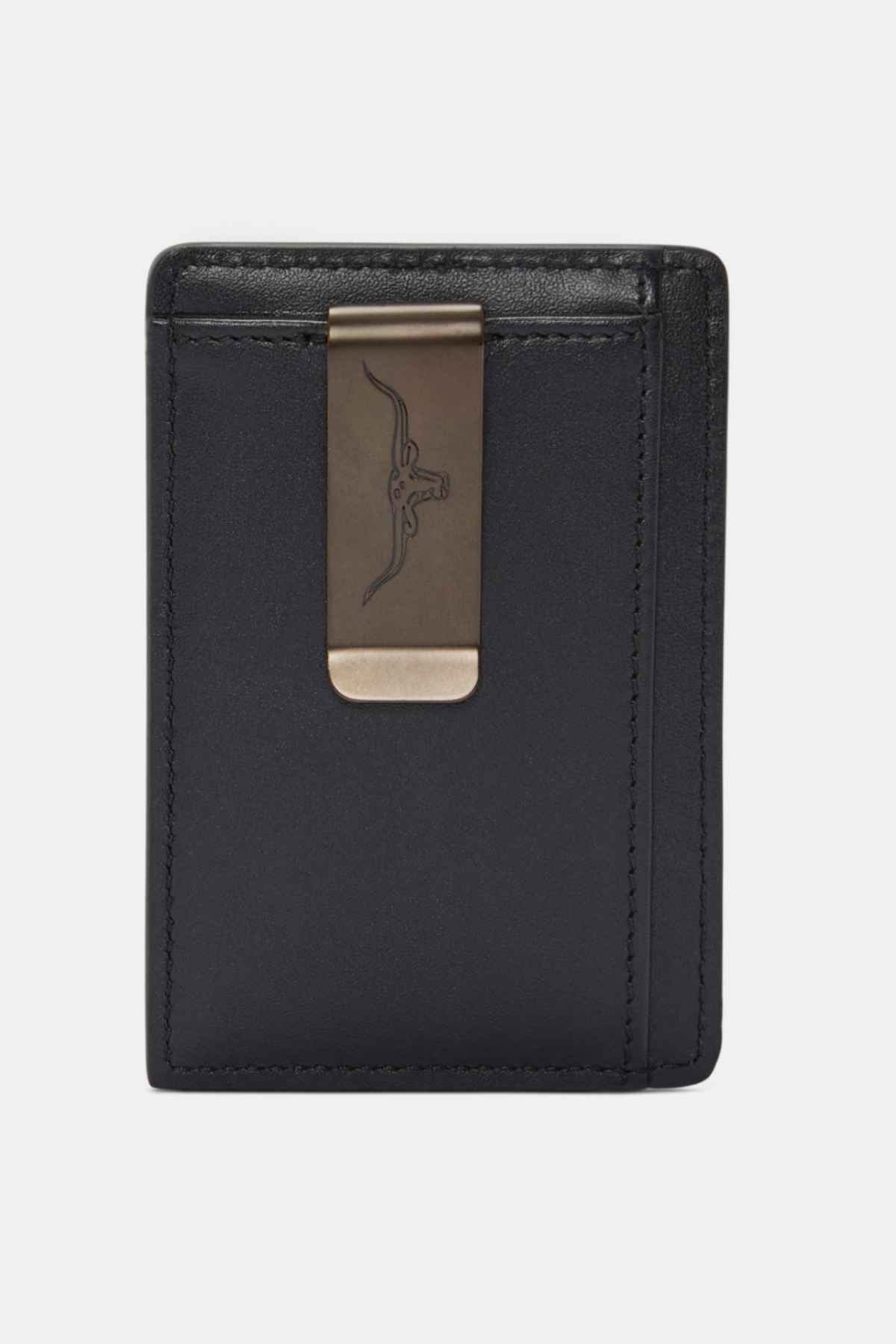 The RM Williams Farrier Cardholder with Money Clip is a sleek, minimalist black premium leather wallet featuring an engraved logo of crossed pistols and a metallic money clip. It offers multiple card slots set against a plain background.
