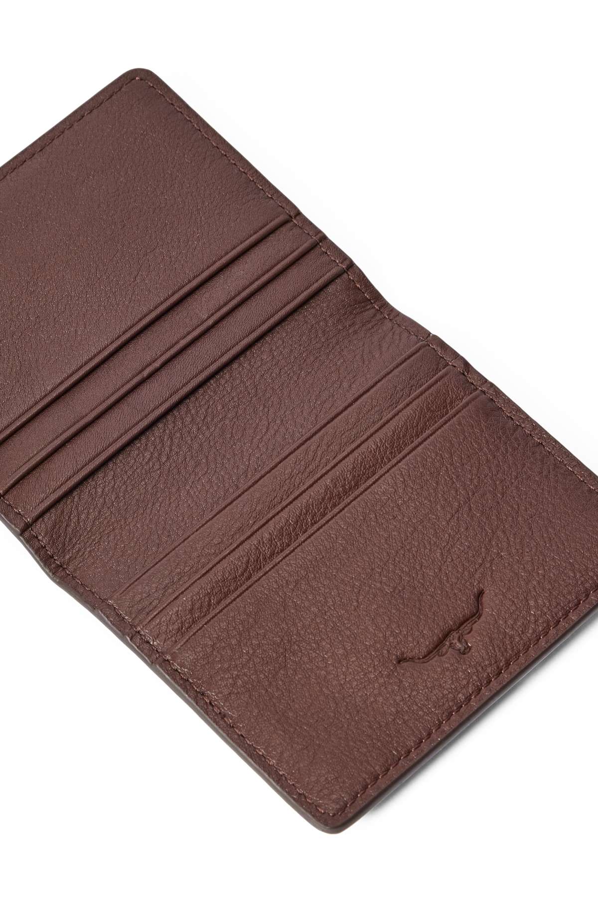 The RM Williams Farrier Fold Cardholder in brown leather opens to reveal multiple card slots on both sides and a subtle embossed bull logo at the bottom right.
