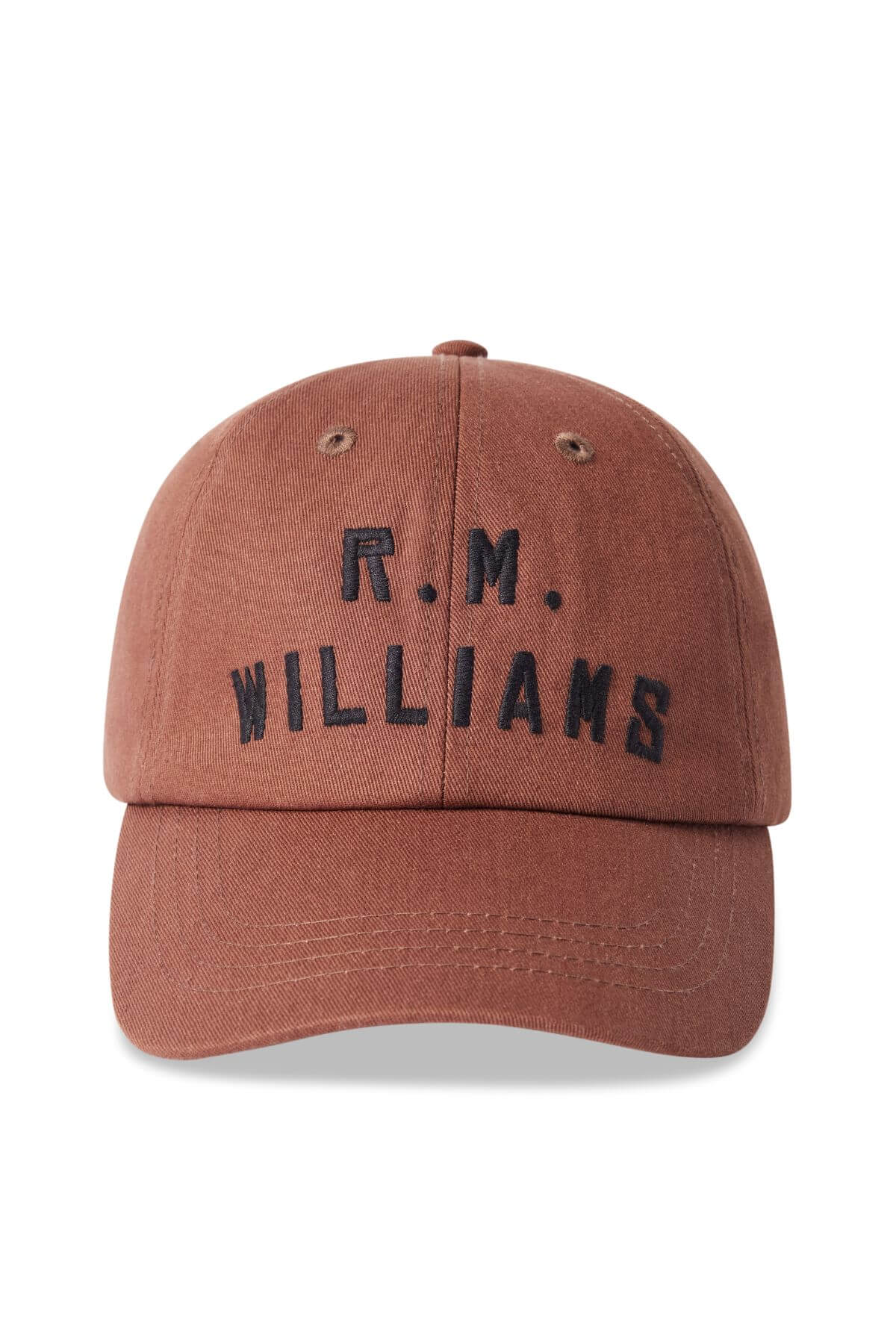 The RM Williams Logo Cap is a brown cotton twill cap with "R. M. WILLIAMS" embroidered in black on the front and an antique brass clasp for adjustable fit.