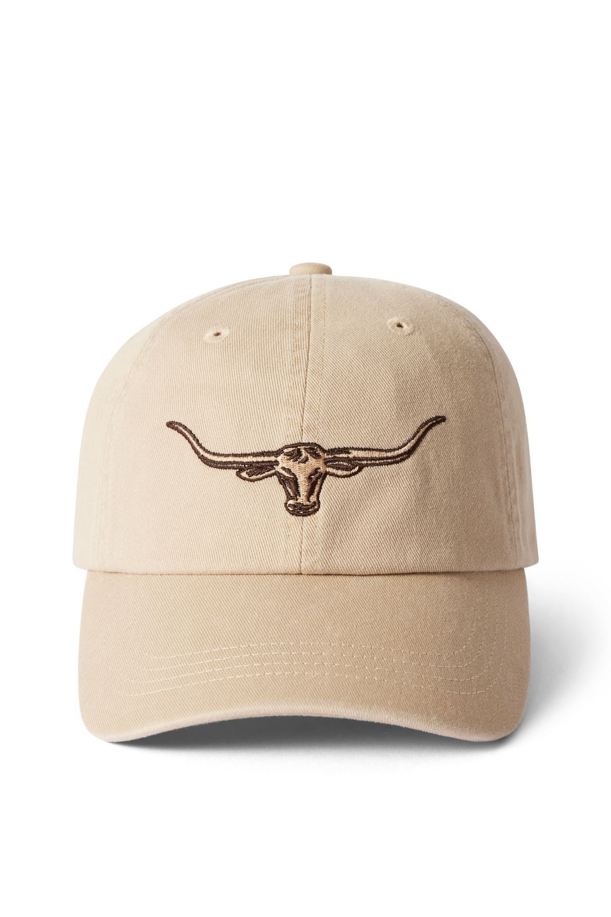 The RM Williams Longhorn Twill Cap is beige with a dark brown embroidered steer head on the front, made from organic cotton twill, and has an adjustable strap. Shown on a white background.