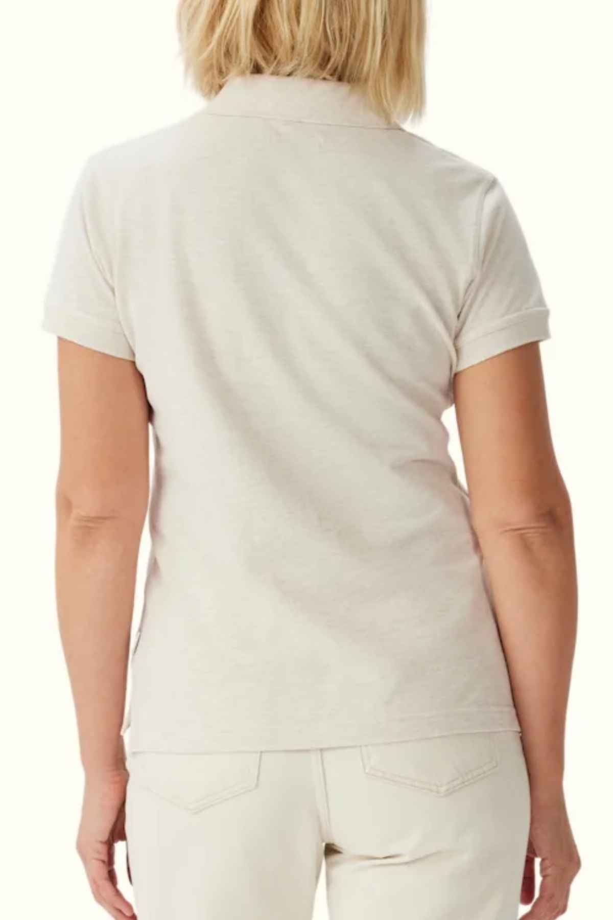 RM Williams Margaret Polo in the colour Oatmeal. Back view of model wearing polo shirt.
