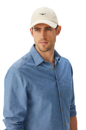 RM Williams Mini Longhorn Cord Cap in the colour cream. Man modelling cap