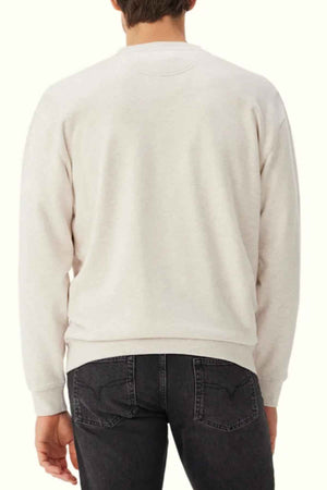 RM Williams Mini Longhorn Sweatshirt in the colour Ecru. Back angle of model wearing jumper