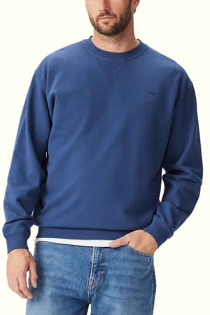 RM Williams Mini Longhorn Sweatshirt in the colour French Navy. Front angle of model wearing jumper