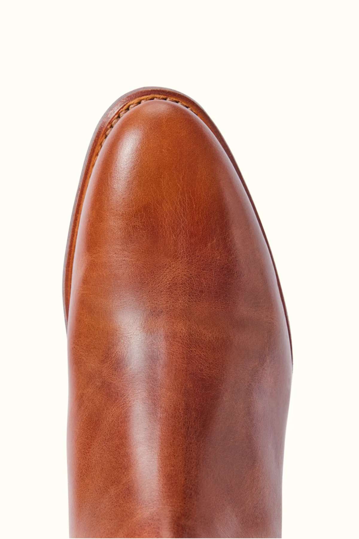 A close-up of the RM Williams Moriarty Rubber Sole Boot, crafted from pull-up leather, showcasing an elegant almond toe design.
