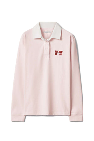 The RM Williams Narran Heritage Rugby is a light pink long-sleeve polo shirt with a white collar and bold red "RAW" print on the left chest, displayed flat on a white background.