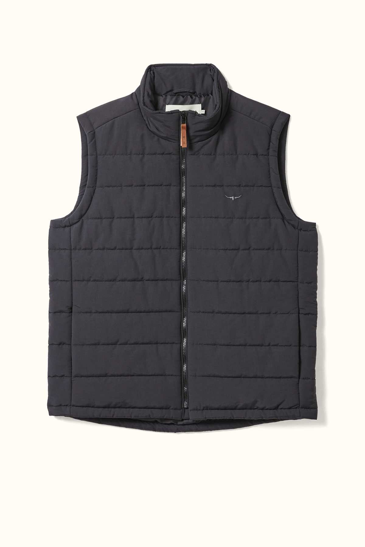 The RM Williams Patterson Creek Vest is a black, sleeveless quilted vest with lightweight padding and a zipper closure. It features a high collar and a small logo emblem on the chest. Crafted from recycled polyester, the padded vest is laid flat on a light background.