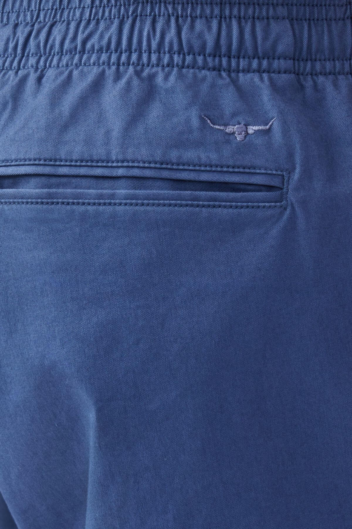 Close-up of the back pocket on RM Williams R.M.W Rugby Short, made from stretch cotton twill with an elastic waistband and an embroidered longhorn skull logo above the pocket, offering a relaxed style.