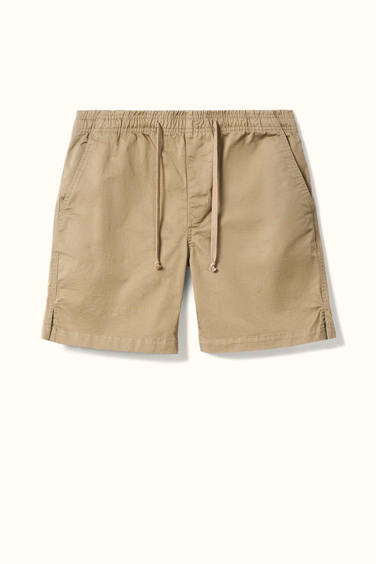 The RM Williams R.M.W Rugby Short in tan, made from washed cotton twill, features side pockets and an elasticated waist. It is displayed against a white background.