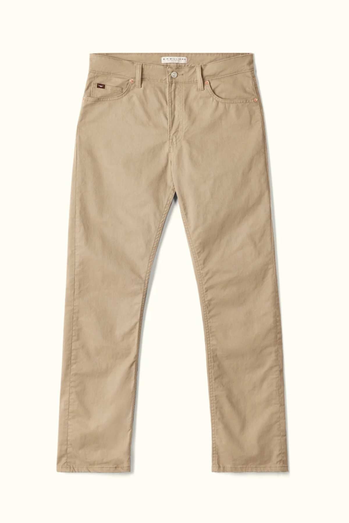 RM Williams Ramco 5 Pocket Jeans in beige, made from stretch cotton twill with a straight-leg fit, feature front and back pockets, a button and zip fly, and belt loops, shown laid flat on a light background.