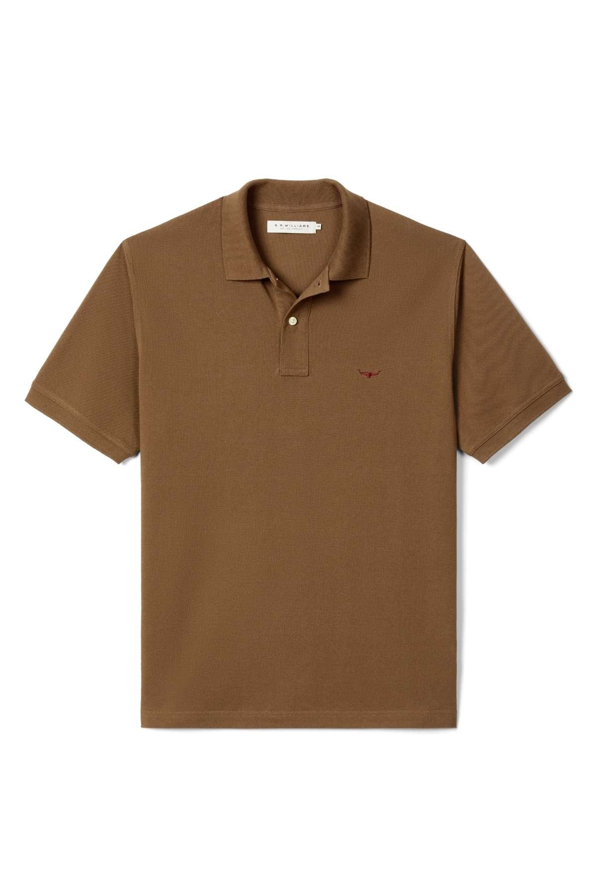 The RM Williams Rod Polo is a short-sleeved brown shirt with a collar, two-button placket, and an embroidered logo on the left chest, displayed flat on a white background.