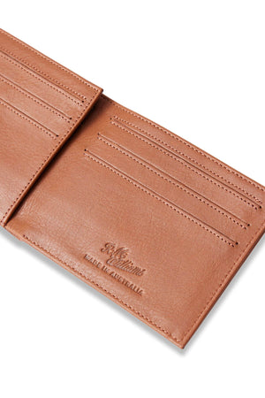 The RM Williams Singleton Bi-fold Wallet is a tan slimline wallet crafted from premium natural milled leather featuring "R.M. Williams Made in Australia" engraved inside. It showcases multiple card slots and is displayed against a white background for elegance and functionality.