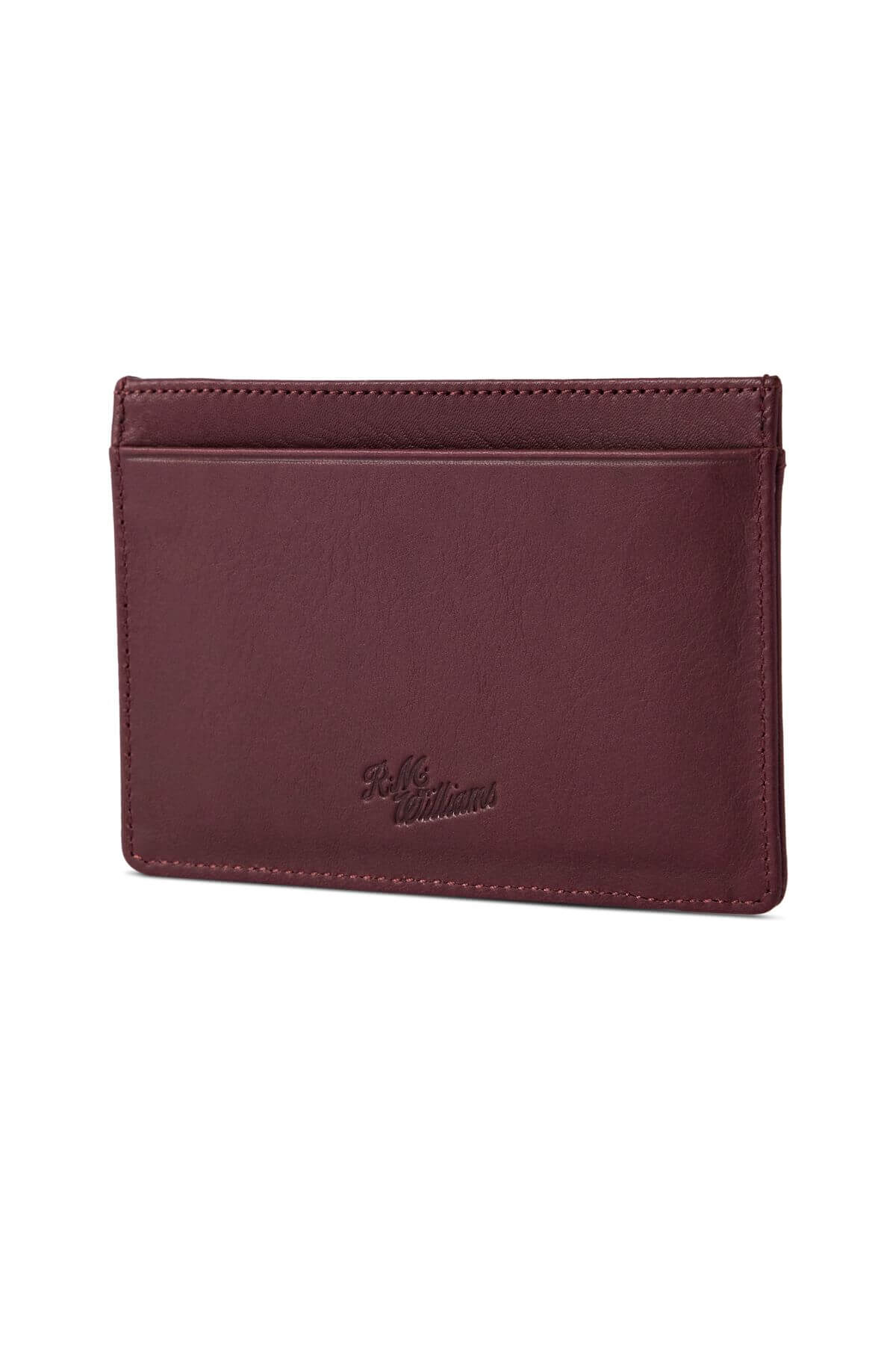 The RM Williams Singleton Vertical Card Holder is a brown leather cardholder with a smooth, minimalist design. It features two card slots on one side, subtle stitching along the edges, and RFID protection. The brand name "Hide & Sleek Urbanwear" is delicately embossed near the bottom center.