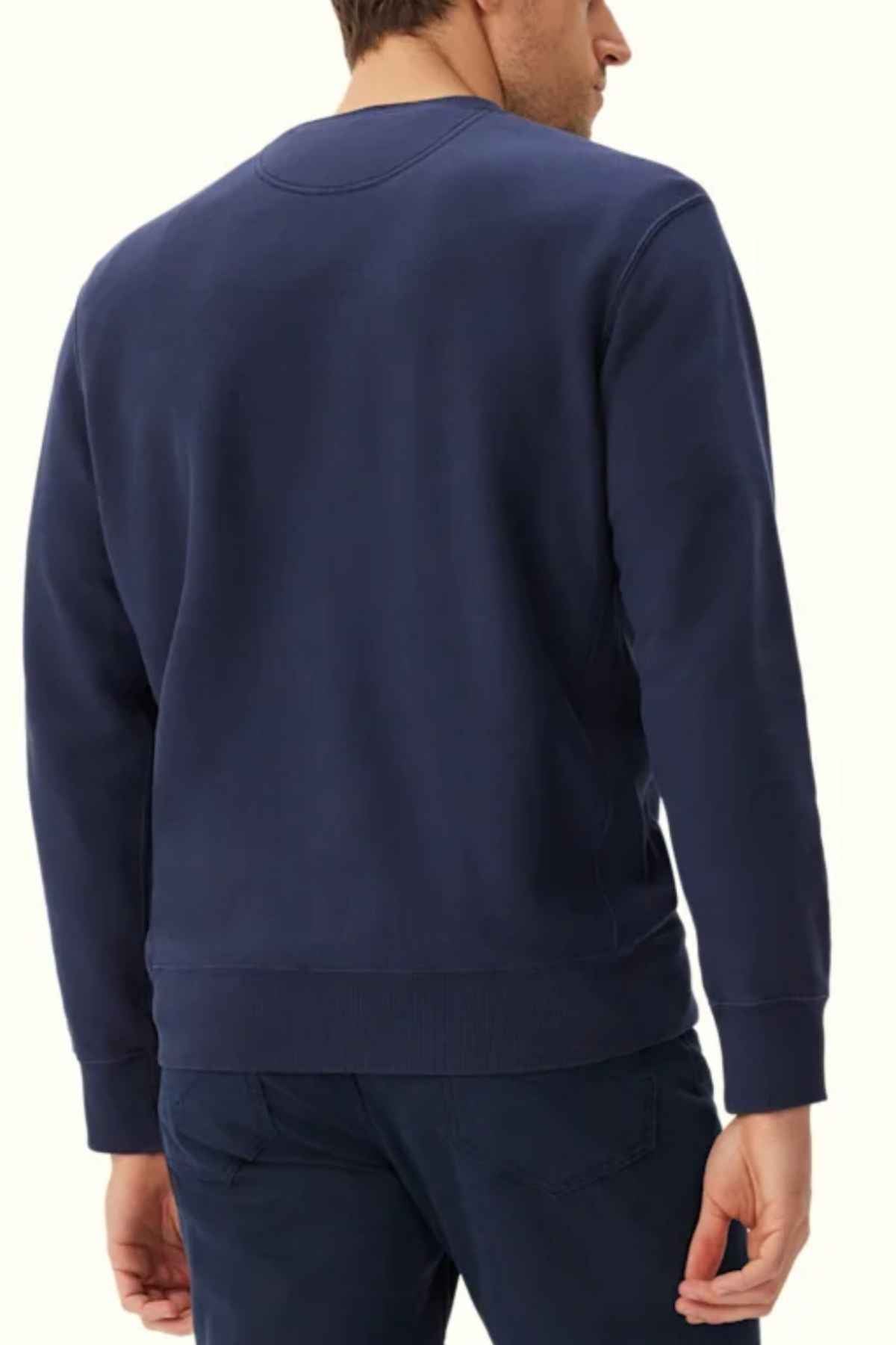 RM Williams Stencil Crewneck Sweatshirt in the colour Midnight. Back angle of model wearing jumper