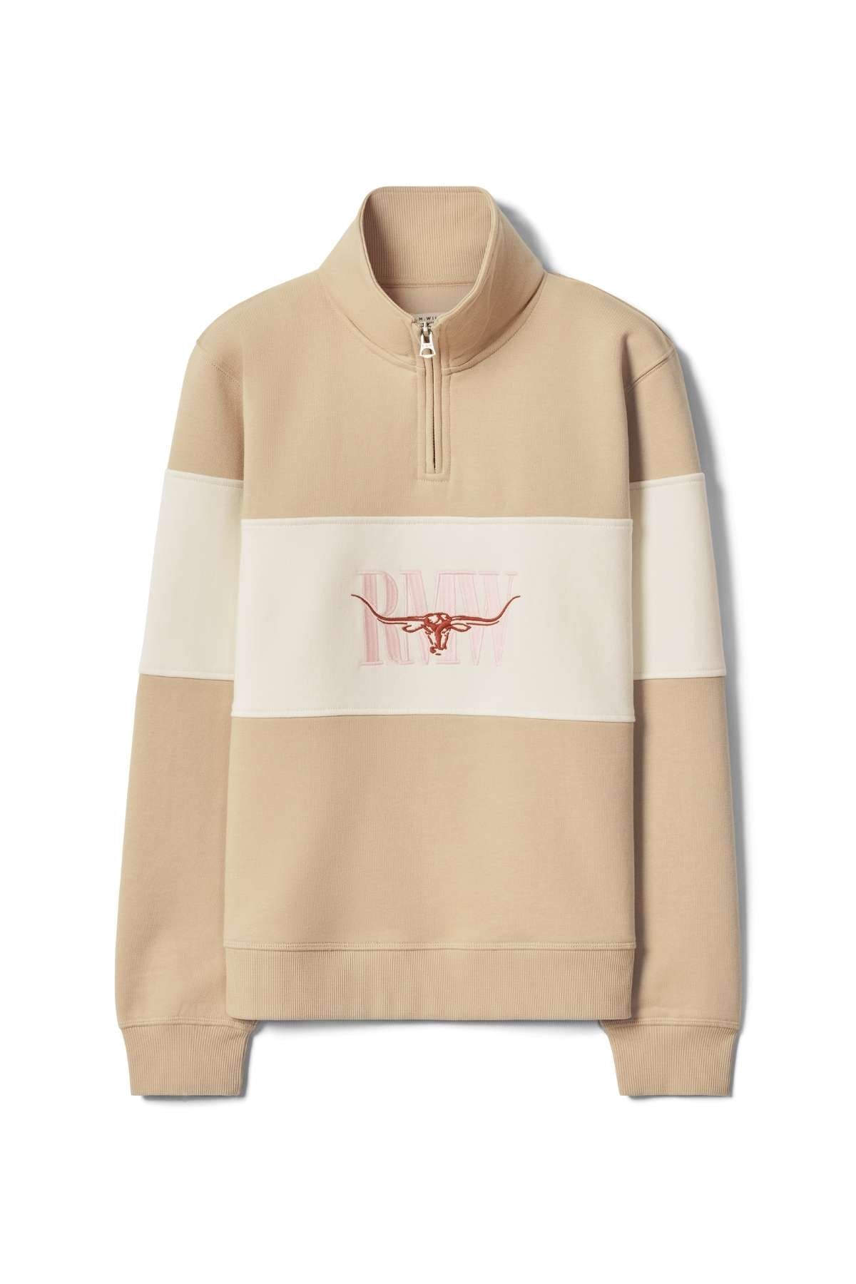 The RM Williams Trickett Panel Sweatshirt is a beige and cream quarter-zip pullover with a stand-up collar, featuring a longhorn graphic and "RAW" on the chest.