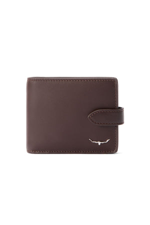 The RM Williams Wallet with Pocket and Tab is a closed full-grain leather wallet featuring a right-side strap and a small silver bull horn emblem in the bottom right corner, displayed against a plain white background.
