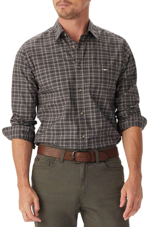 A man wears the RM Williams Warrah Poplin Check Shirt with rolled-up sleeves, paired with olive green pants and a brown belt. His head is slightly turned, partially out of the frame.