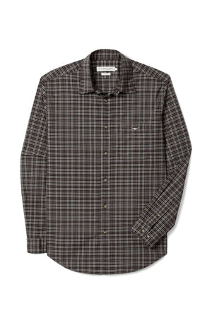The RM Williams Warrah Poplin Check Shirt is a long-sleeve button-up with a brown, black, and white plaid pattern, pointed collar, and chest pocket, shown on a white background.