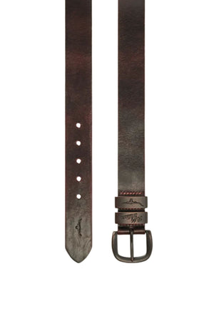 The RM Williams Drover Belt is crafted from brown vegetable-tanned leather, featuring a silver buckle, multiple adjustment holes, and a small embossed alligator logo near its pointed end.