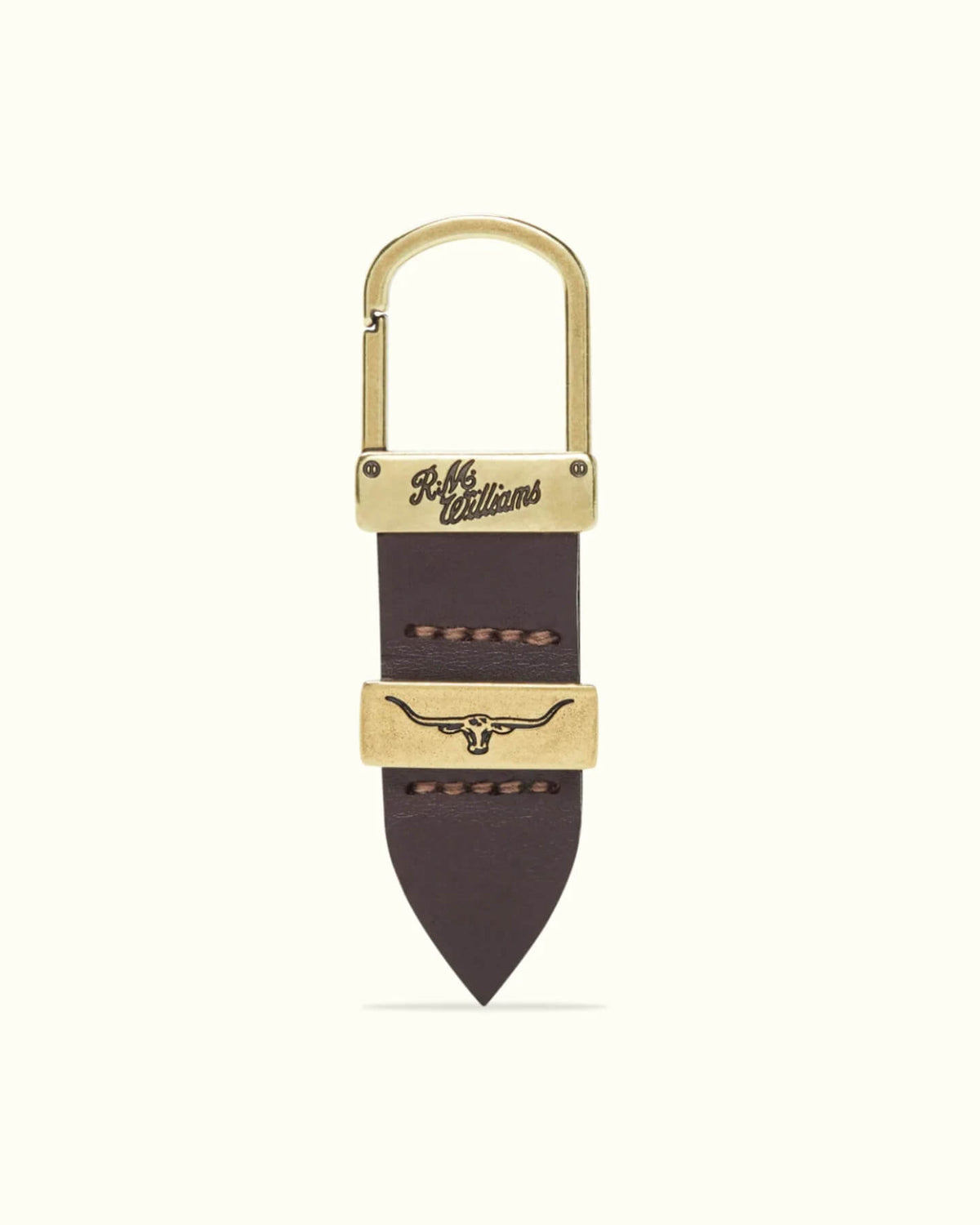 The RM Williams Drover Key Fob is crafted from brown double butt leather with brass hardware, features "RRL & Co. Est. 1993" engraving, a longhorn symbol on the brass accent, and detailed stitching inspired by Australian design.
