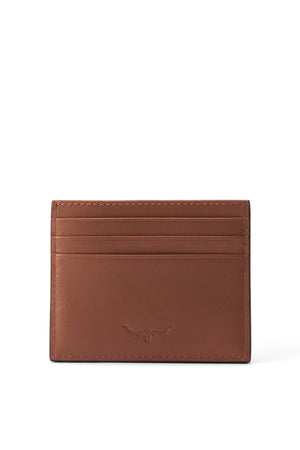 The RM Williams Farrier Cardholder is a brown full grain leather piece with multiple card slots and a subtle embossed longhorn logo on the front, shown against a white background.