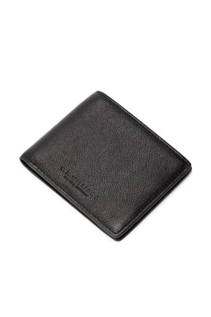 The RM Williams Farrier Slim Bi Fold Wallet in black leather features a textured finish, subtle embossed branding, and multiple card slots. It is shown partially closed on a white background.