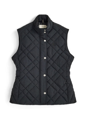 The RM Williams Ikara Vest, shown in black, is a sleeveless, quilted vest featuring snap buttons, a stand collar, and side elastic details, laid flat on a white background.