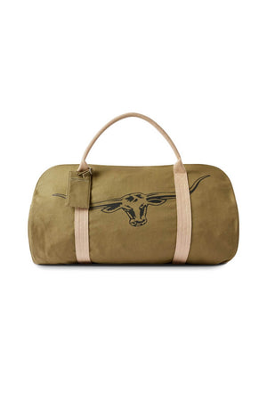 The RM Williams Nanga Canvas Bag is a khaki green weekender duffle with tan handles, a zipper, and a black outline drawing of a longhorn steer head on the front.