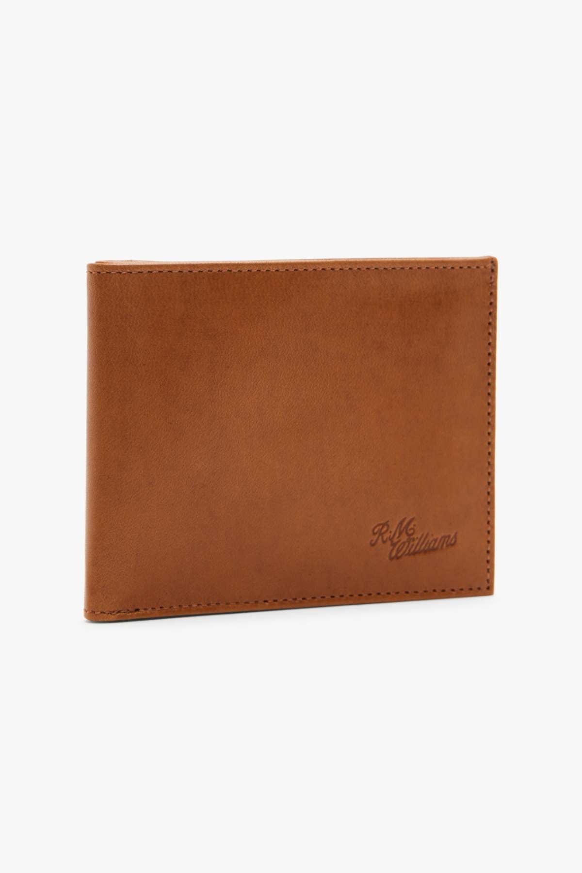 The RMW Singleton Wallet with Coin Pouch, crafted from brown calf leather and featuring the embossed "R.M. Williams" logo in the bottom right corner, is elegantly closed and set against a plain white background. With RFID protection, this wallet combines security with timeless style.