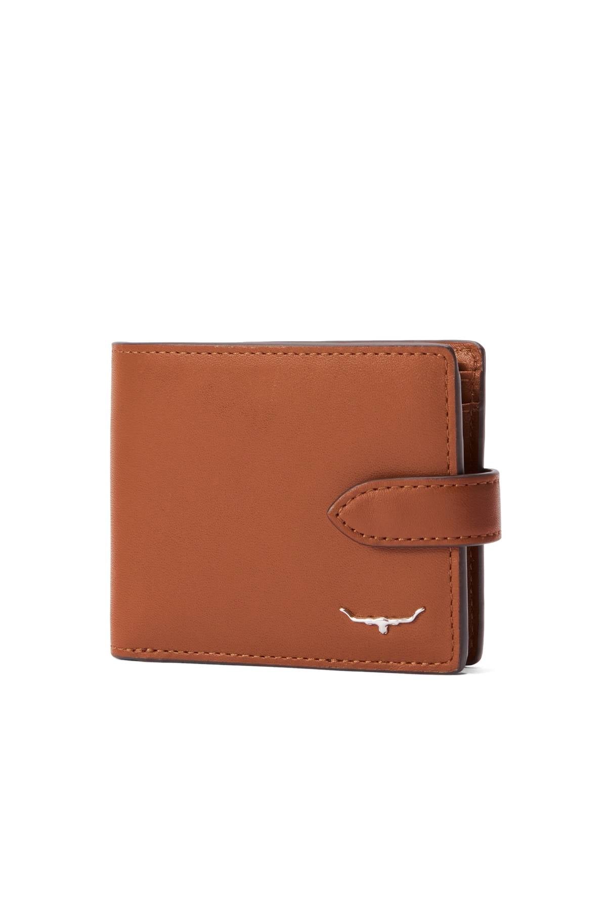 The RM Williams Wallet with Pocket and Tab, made from brown full grain leather with a snap closure strap and a small silver longhorn logo in the bottom right corner, is photographed against a white background.