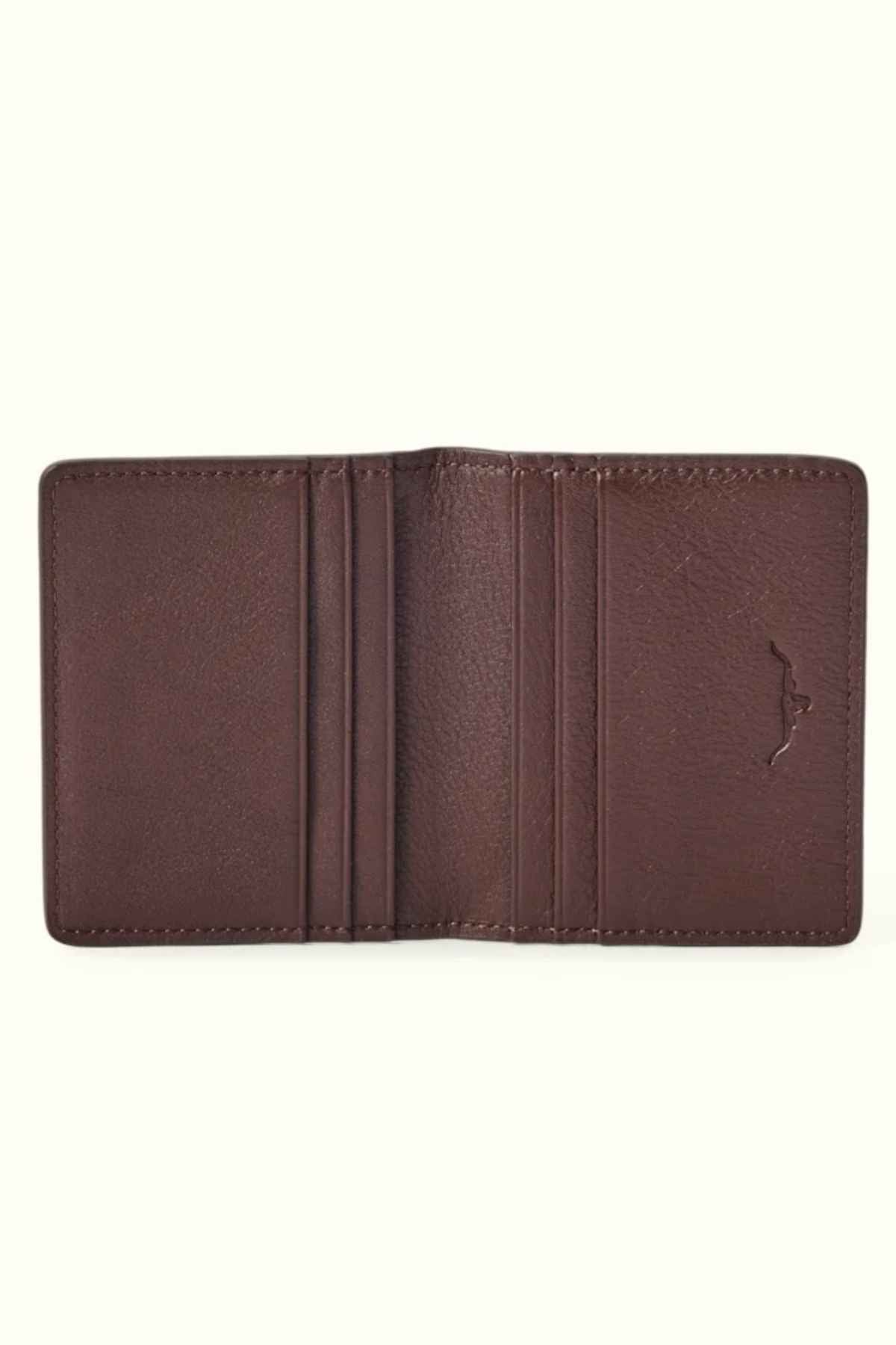 The RM Williams Farrier Fold Cardholder, designed in an open brown style and crafted from premium leather, features multiple card slots against a plain background.
