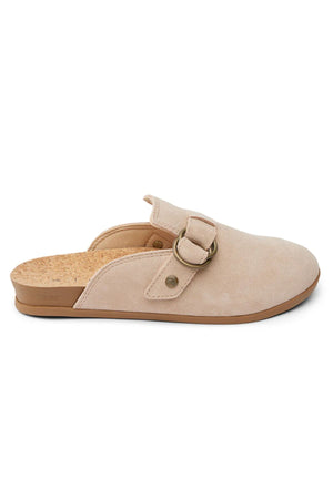 The REEF Vista Serenity mule in beige suede offers a closed toe, open back, cork insole, and a decorative strap with a round metal buckle—ideal for stylish and comfortable women's footwear.