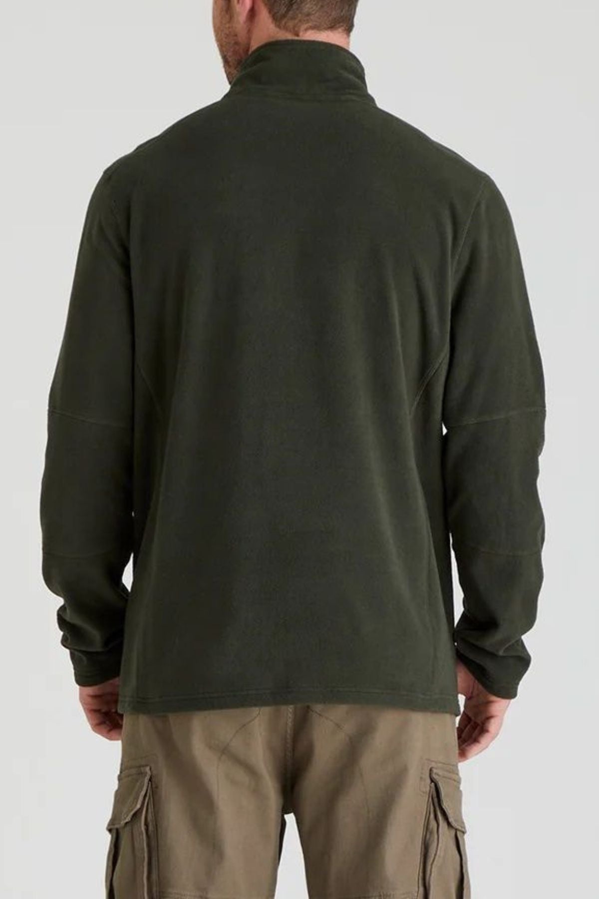 A man shown from the back wears the Ridgeline Narvik Fleece in olive green with a lightweight zip-neck and khaki cargo pants, standing against a plain light gray background.