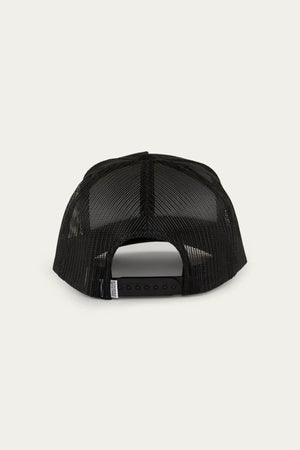 Rear view of a Ringers Western Can Trucker cap featuring a black mesh back and adjustable snapback; poly mesh enhances ventilation for a light feel. Background: light cream.