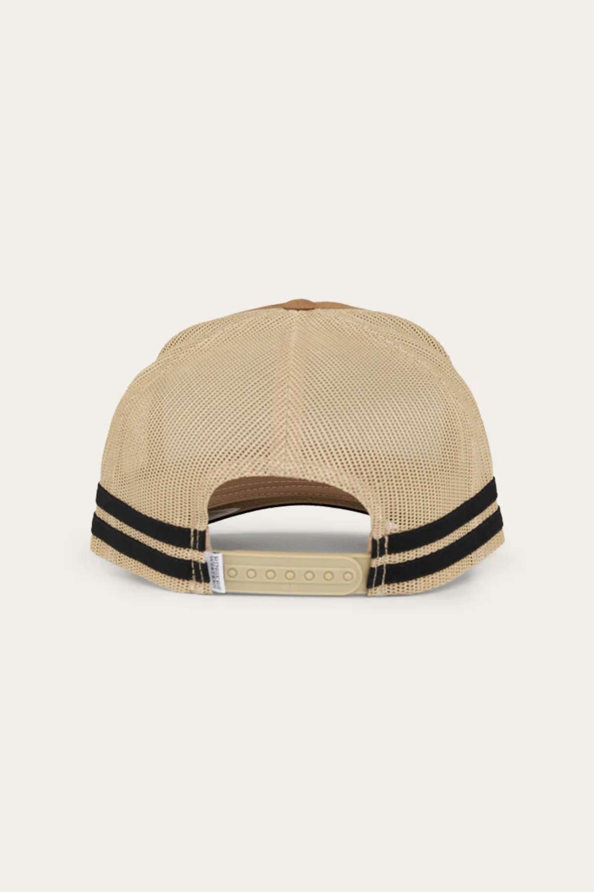 The image shows the back view of a beige Ringers Western Cobar Trucker Cap featuring a mesh back and two black horizontal stripes. The cap includes an adjustable snapback closure and an internal sweatband for added comfort.