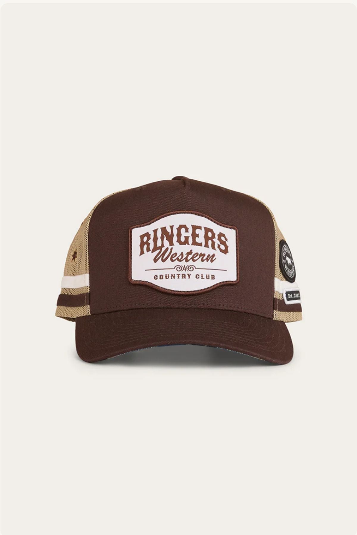 The Ringers Western Country Club Deep Fit Trucker Cap in brown and beige features a mesh back, front "Ringer's Western Country Club" patch, and a circular black and white side patch for classic country style.