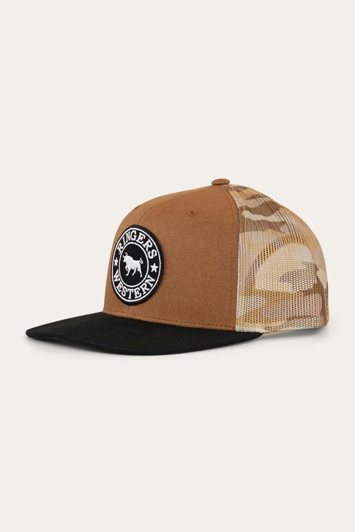 The Ringers Western Dalby Trucker Cap features a brown and black camo design, mesh back, and circular "Ringers Western" logo patch. Made from cotton twill with an adjustable snapback for the perfect fit.