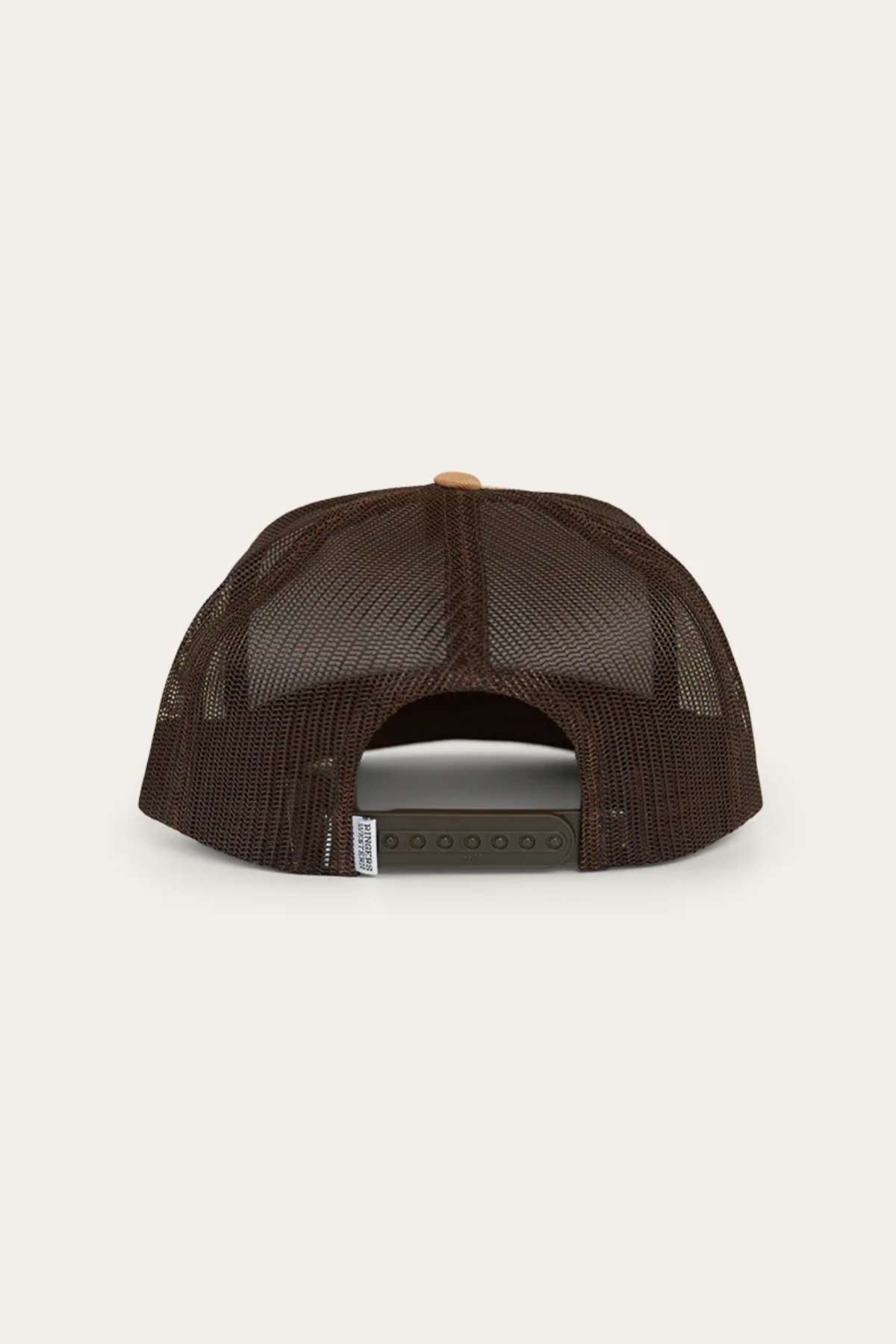 The back of the Ringers Western Dalby Trucker Cap, in dark brown cotton twill, features an adjustable snapback closure against a light background.