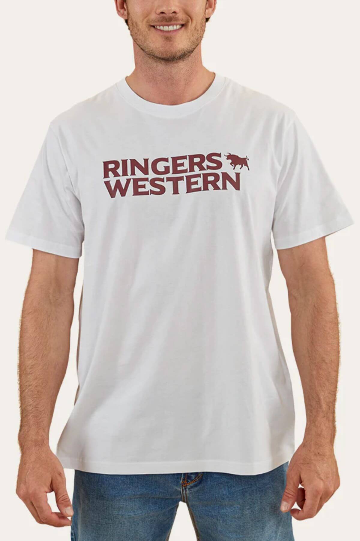 Someone is sporting a Ringers Western Hastings Loose Fit T-Shirt made from 100% cotton jersey, featuring "Ringers Western" and a horse design. They team it with blue jeans against a simple, light background.
